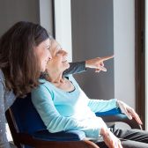 positive mother and daughter enjoying dramatic view